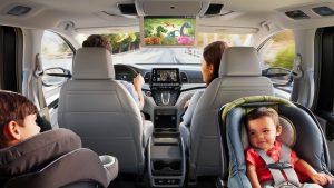 A family of four seated inside of a 2019 Honda Odyssey. | Honda Dealer in San Antonio, TX
