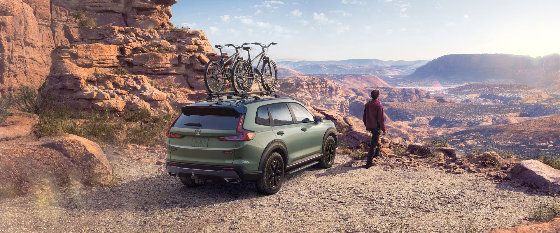Green parked SUV at a overlook