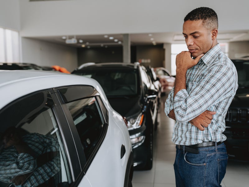 Customer examining a new honda