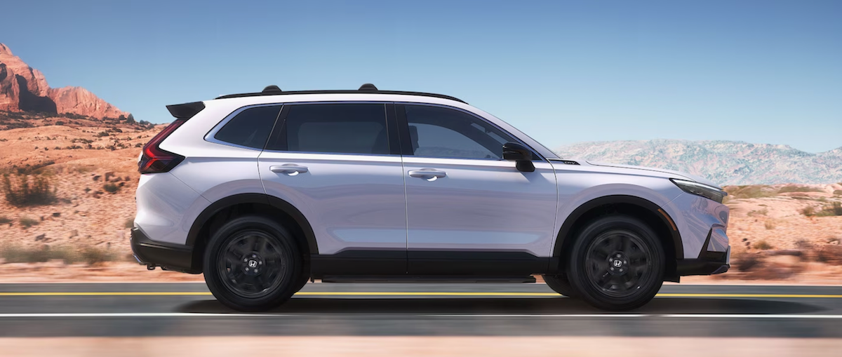 Does the Honda CR-V Hybrid Get Good Gas Mileage? White Honda CR-V Hybrid driving