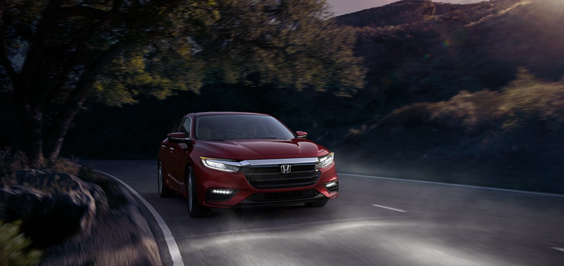 Honda Insight Driving Front Grille View Red